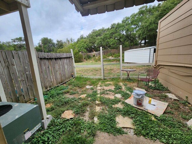 Small fenced yard opens to larger fenced yard. - 2491 Canyon Lake Forest #C