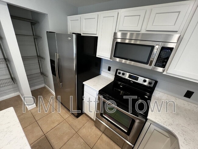 Building Photo - 9673 W Chatfield Ave