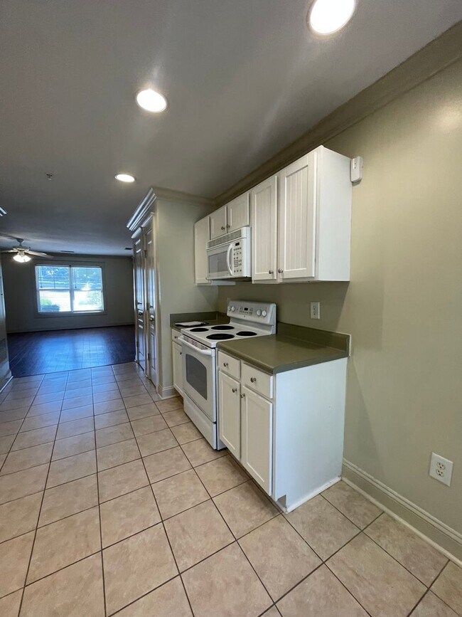 Building Photo - Two Bedrooms Available in this Three Bedroom Flat, Female Applicants!