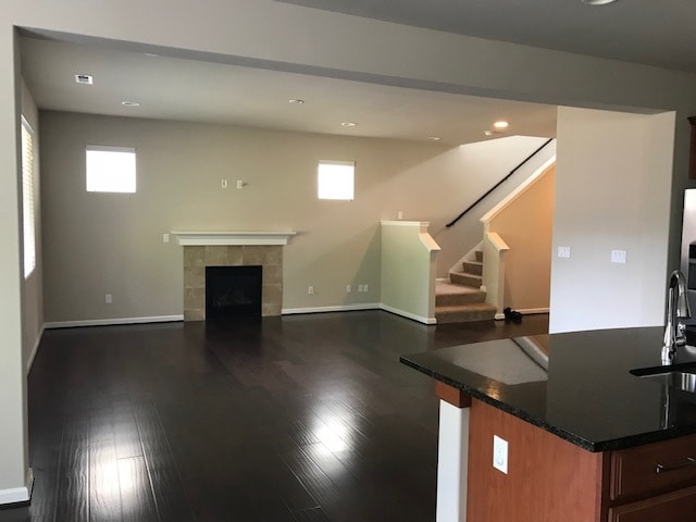 View of living room, from dining - TV bracket has been mounted - 8828 Jayden Ln NE