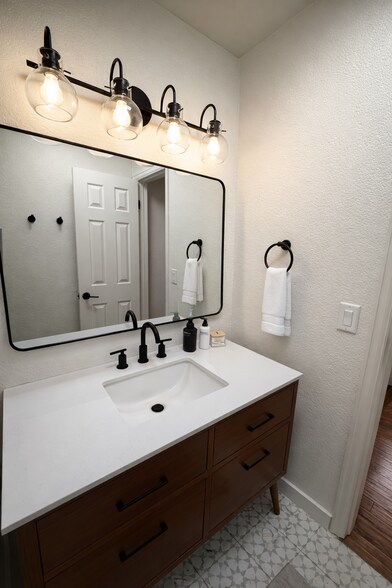Well-designed bathroom featuring a separate water closet for added privacy. - 524 Superior St