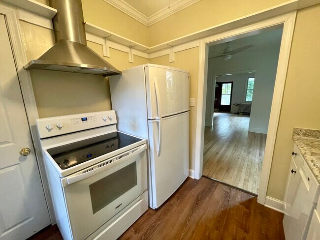 Galley kitchen. From doorway you view dining room and living room with front entrance - 6027 Ridge Dr