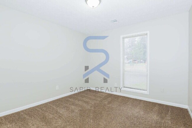 Building Photo - A Peaceful Woodland Retreat – 3BR/2BA Home in Jonesboro