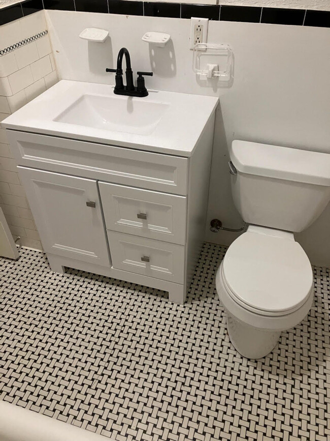 bathroom with new vanity, sink, toilet - 445 N Winton Rd