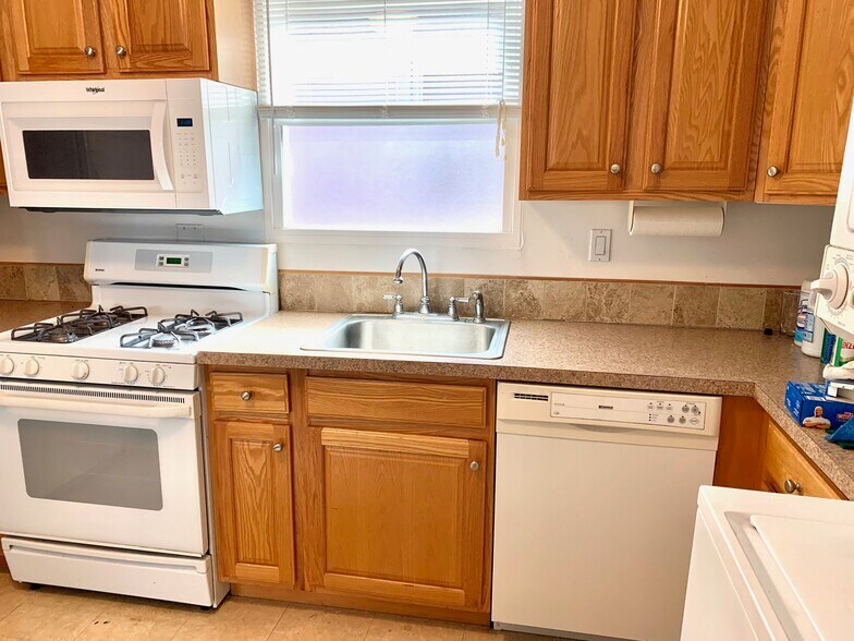Kitchen showing range and dishwasher - 203 5th St