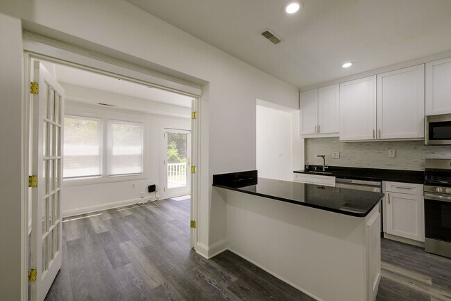 Building Photo - Charming & Renovated Petworth Rowhouse with Parking -  Available Now!