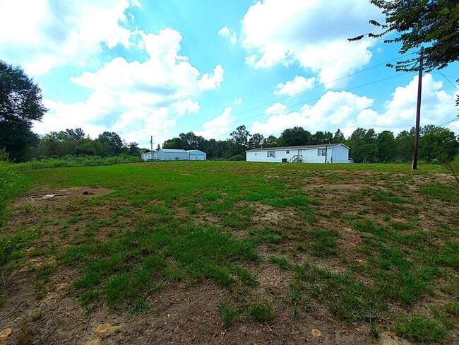 Building Photo - Spacious 4 bedroom with 3 FULL bathrooms nestled on 2 acres! MUST SEE!!!
