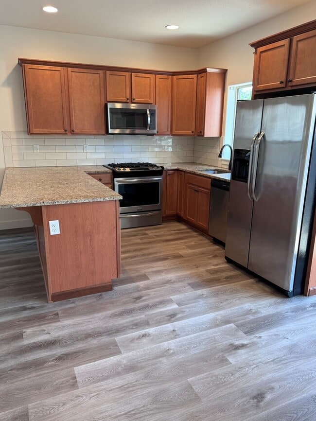 Building Photo - Beautiful Home with LVP Flooring, SS Appliances, Garage, W/D, Fenced Yard, LARGE Master & MORE!