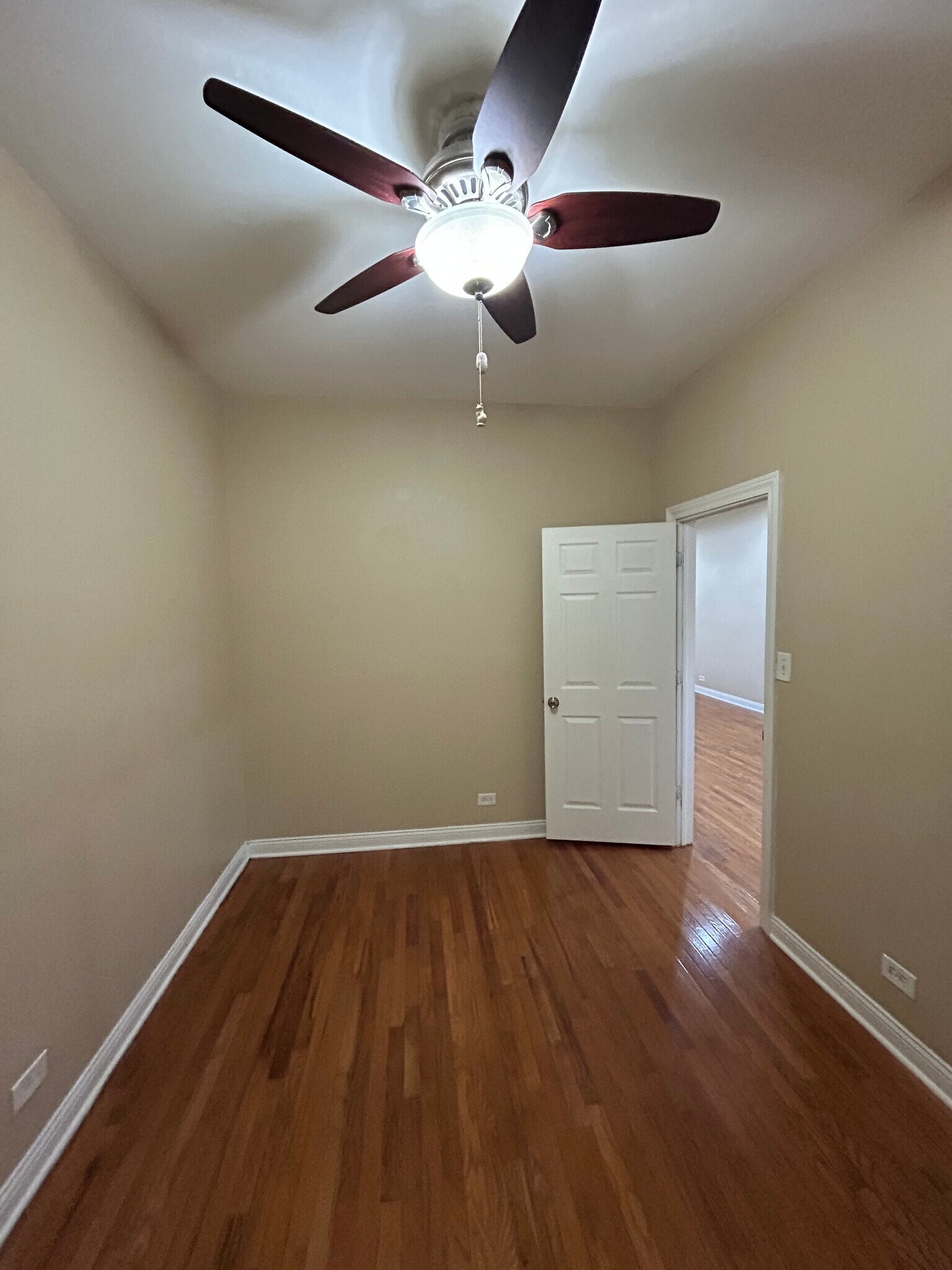 First bedroom which includes ceiling fan - 6630 S Ingleside Ave