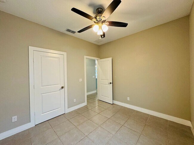 Building Photo - Beautiful New 3-Bedroom Home with Spacious Layout & 2-Car Garage in Poinciana Villages