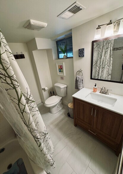 Full bathroom with shower/tub combination. - 11116 Kensington Ave