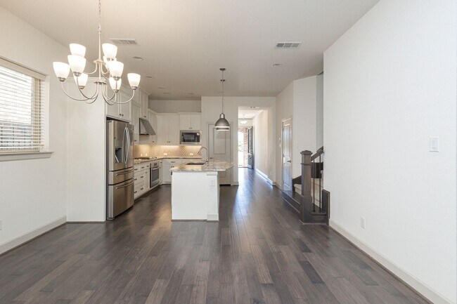 Building Photo - This house offers beautiful open floor plan with high ceilings and lots of natural light.