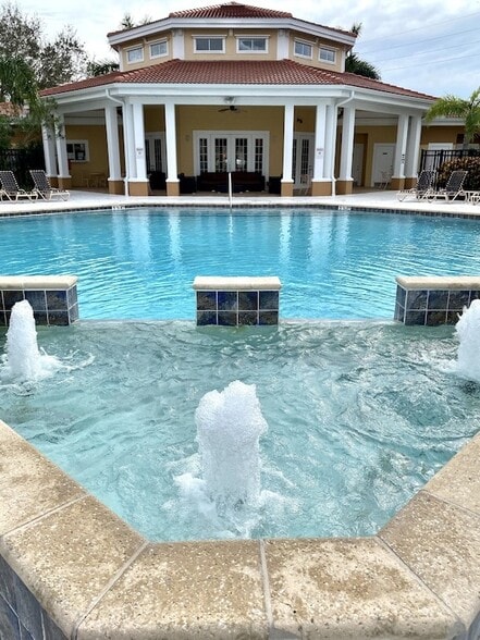 Pool has a soothing waterfall feature - 1025 Villagio Cir