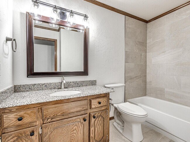 Building Photo - 4 Bedrooms - 3 Bathrooms - 3 Car Garage - ...