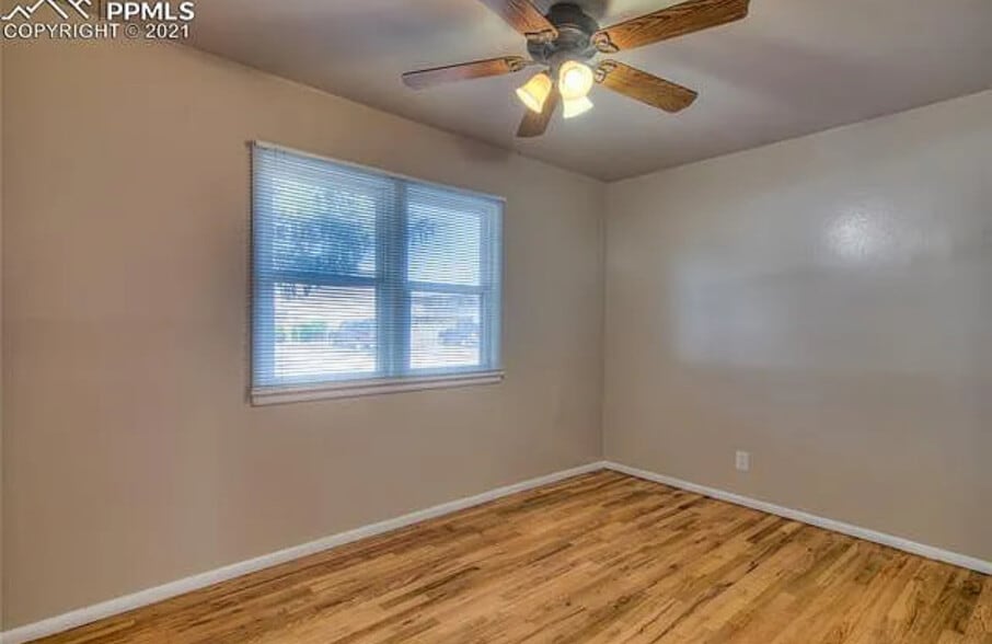 Larger front bedroom, now light pink with leaf wallpaper, built ins in closet - 3121 N Arcadia St