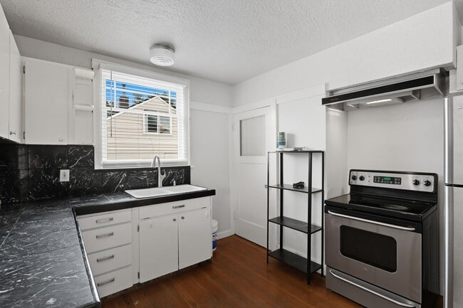 Building Photo - Charming Bungalow with Spacious Loft Suite and Large Backyard