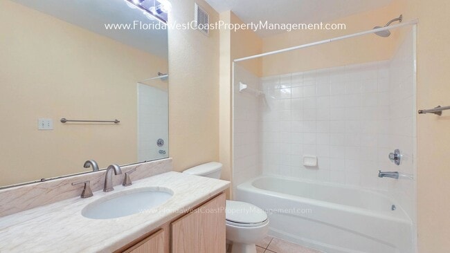 Building Photo - MOVE IN READY! LARGE 2 BEDROOM/2 BATH PLUS ATTACHED GARAGE! TILE/LVP THROUGHOUT!