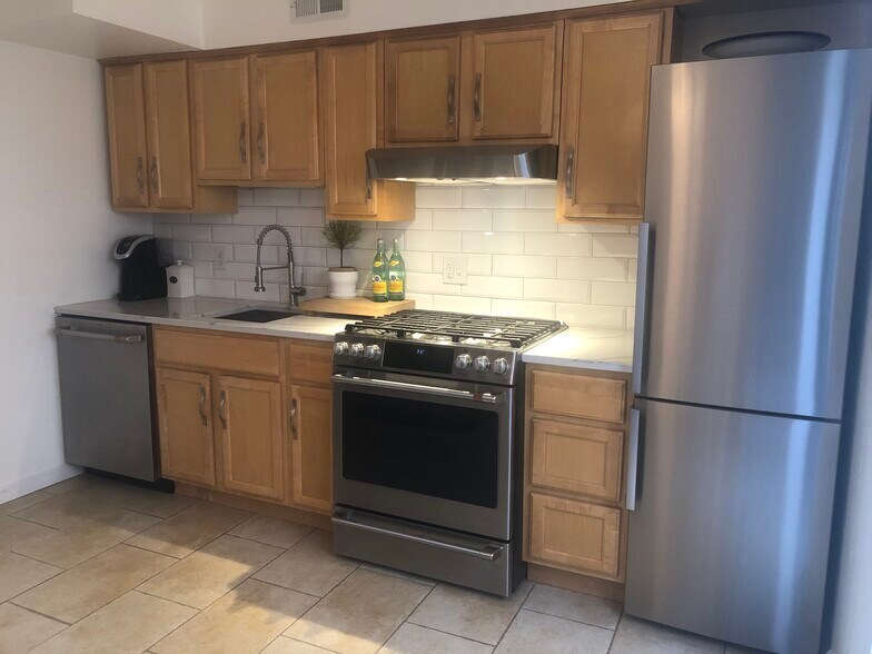 Kitchen with new stainless appliances - 330 Pemberton St
