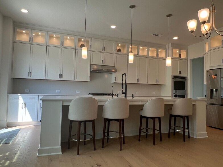 luxury kitchen with to the ceiling cabinets - 6490 Pond View Dr