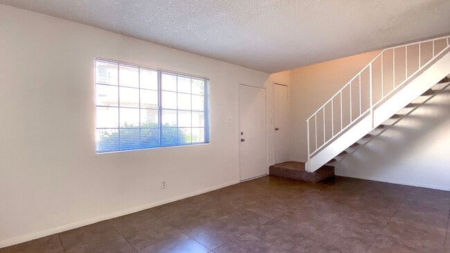 Building Photo - Great 3 bedroom and 1.5 bath townhouse with a small yard and 2 car garage.