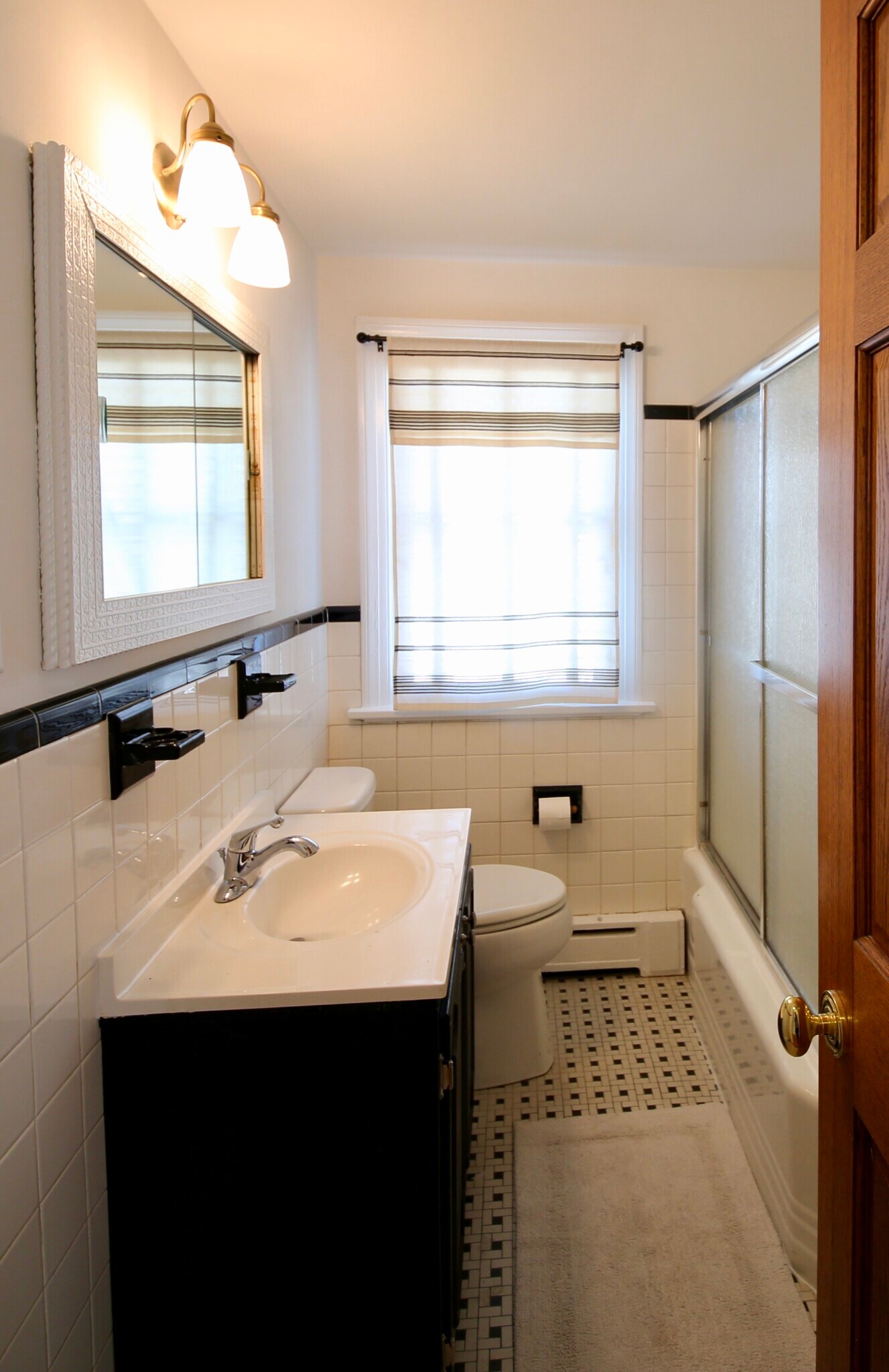 Upstairs bathroom has bathtub and linen closet. - 2308 Buckingham Ave