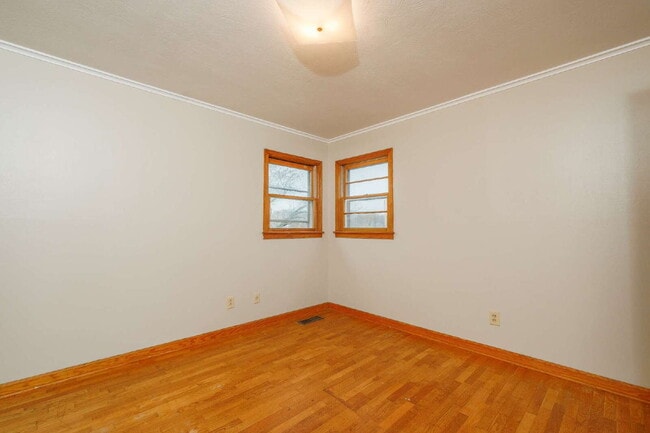 Building Photo - "Charming 3-Bedroom Greenfield Home with Gleaming Hardwood Floors – 1256 Sq Ft of Cozy Comfort!"