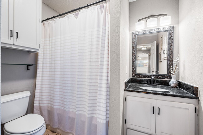 Second bathroom with a tub/shower combo. - 209 Prairie Wind Blvd