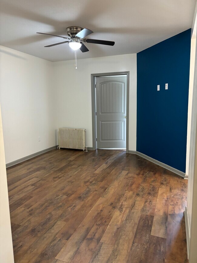 Living room door to rear bedroom & internetnet - 135 W Miller Ave