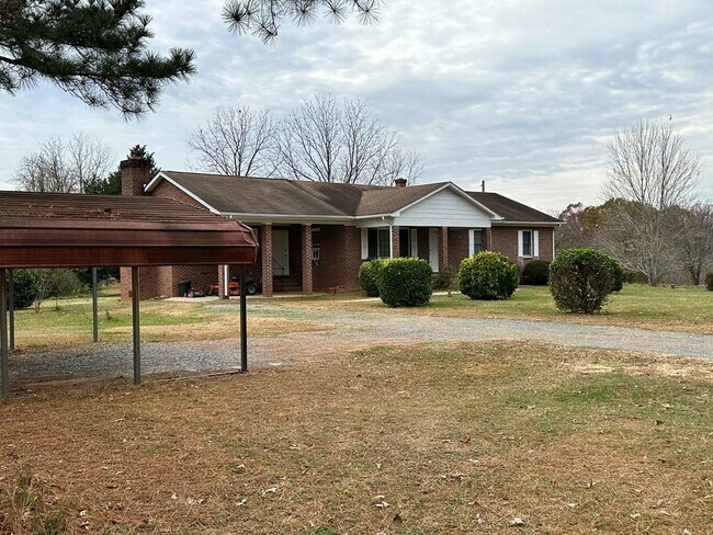 Building Photo - 4-Bedroom Brick Home with Full Unfinished ...