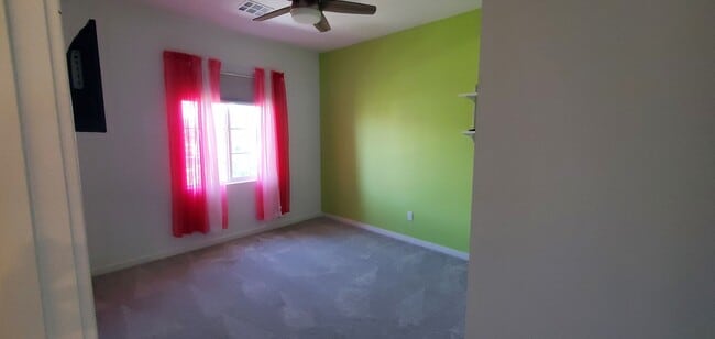 Building Photo - Beautiful townhome features a bright, open-concept layout