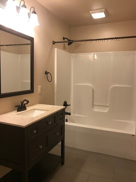 Master bath with ceramic flooring and walk-in closet. - 206 Stallion Way