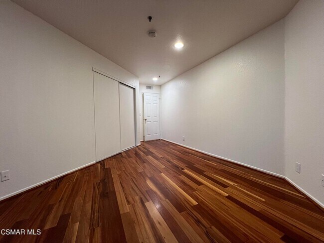 Building Photo - Welcome to this beautifully situated first-floor end unit