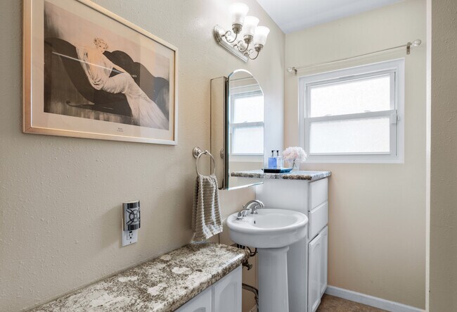 Large bathroom with plenty of storage. - 1150 W 25th St