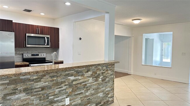 Building Photo - 4460 NE 13th Terrace