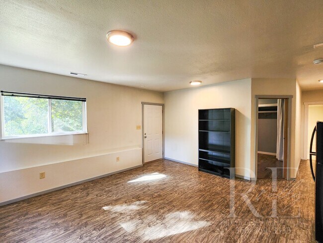 Building Photo - Vaulted Ceilings, Unique Designer Kitchen & Expansive Half-Acre Setting with Flexible Living Spaces