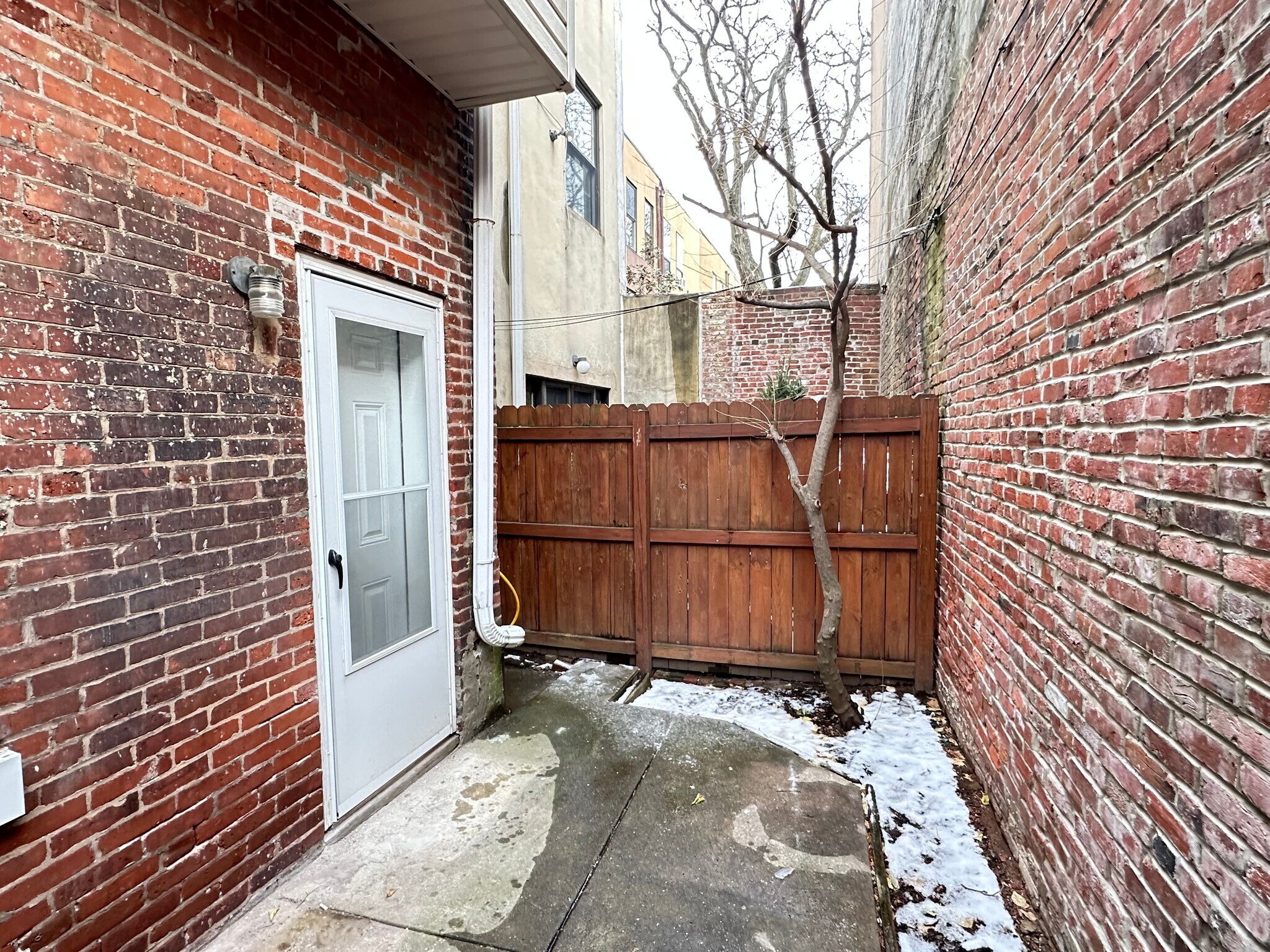 The backyard is gray in the winter, but is a blank canvas for you to get it ready for spring blooms. - 336 Fitzwater St
