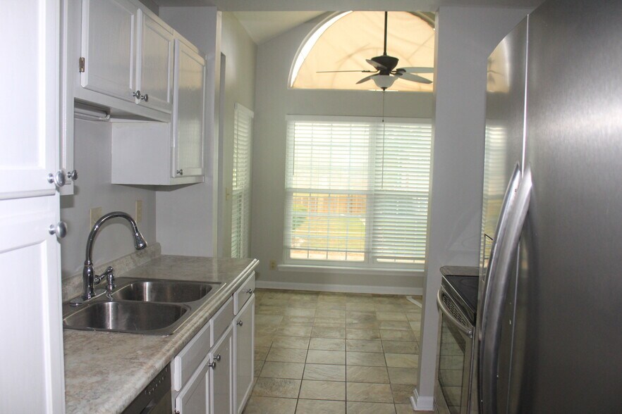 Kitchen area &amp; Sunroom - 1049 Stones Throw Dr NW