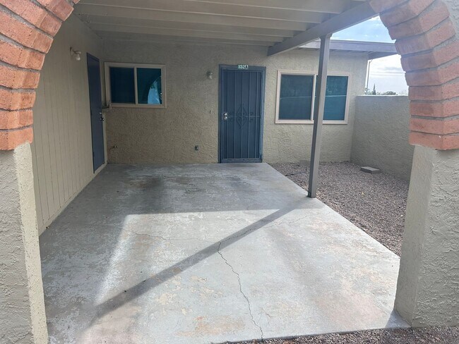 Building Photo - 2 bedroom 1 bath unit with laundry room, enclosed yard and carport.