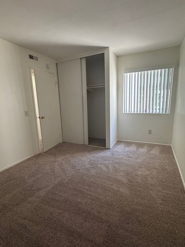 Building Photo - Upstairs two-bedroom 1/12 bath condo avail...