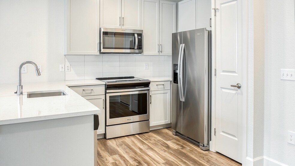 New stainless steel appliances in renovated homes - Windsor at Broadway Station