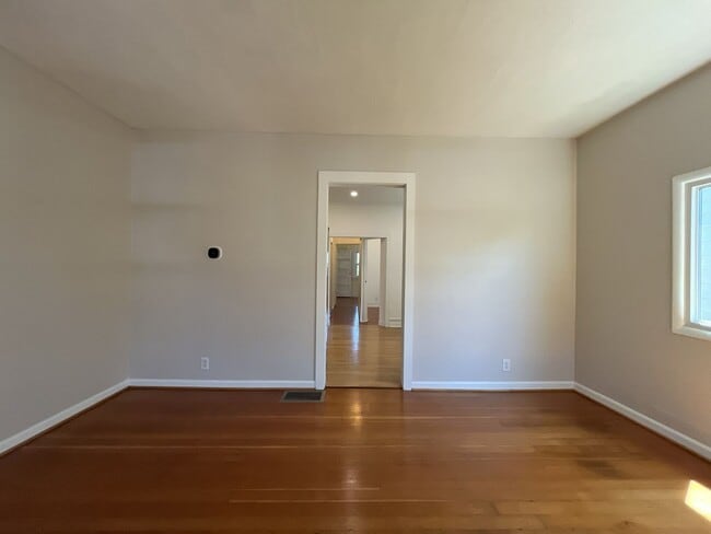 Building Photo - Charming Cottage with Hardwood Flooring, Modern Kitchen & Beautiful Outdoor Living Areas