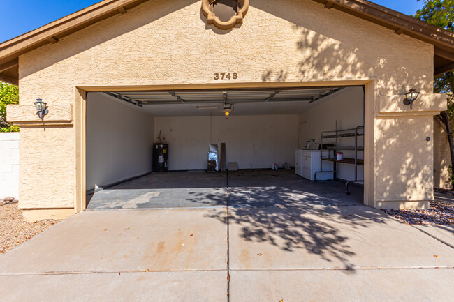 Full garage with new hot water heater - 3748 W Carol Ann Way