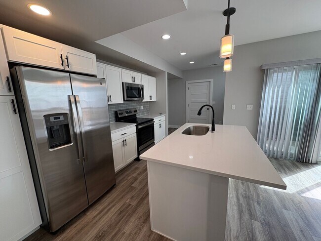 Building Photo - Modern 2 Bed + Flex Townhome with Rooftop Deck Near Paco Sanchez Park & Light Rail