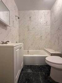 Building Photo - "Charming 1-Bedroom Furnished Apartment with Hardwood Floors in Queens – 750 Sq Ft of Comfort!"