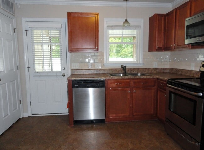 Building Photo - End Unit with Lots of Upgrades!