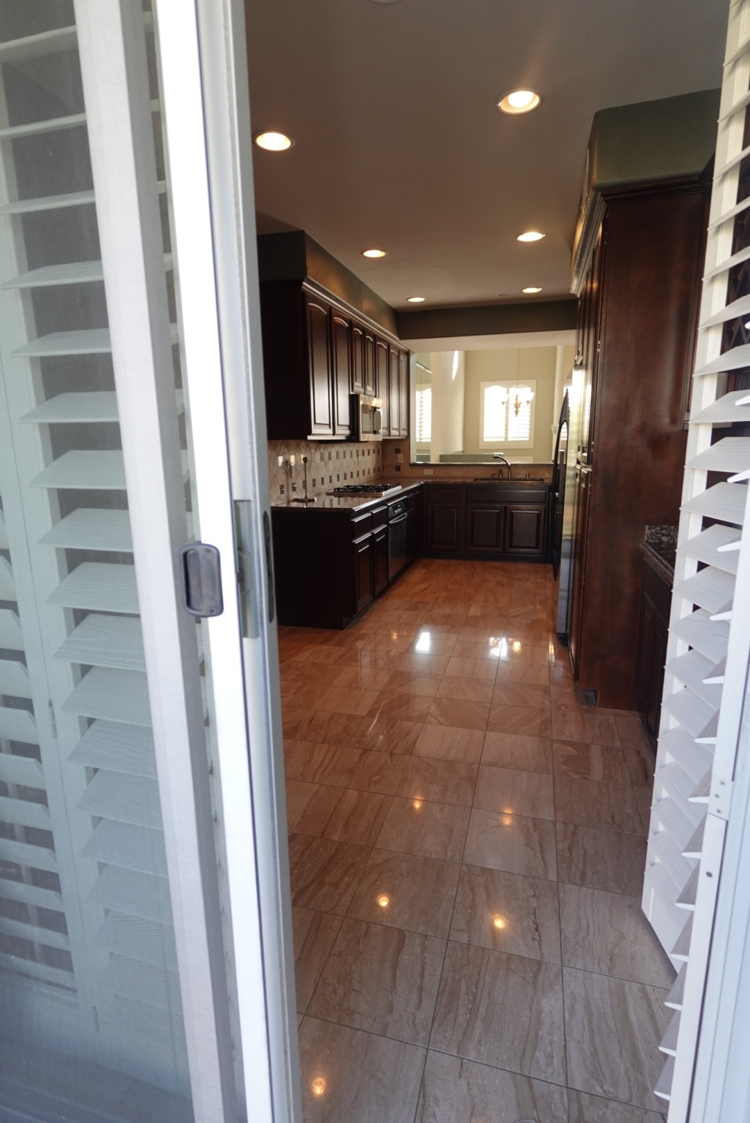 Looking into the kitchen from the patio - 8894 Spectrum Center Blvd