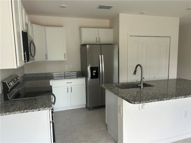 Building Photo - 8616 100th Ct