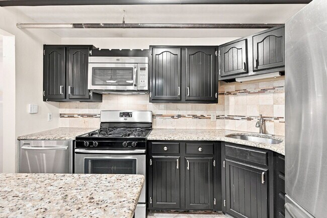 Building Photo - 1,795.95, 2-bedroom, 1-bathroom Updated in Great Denver Location!