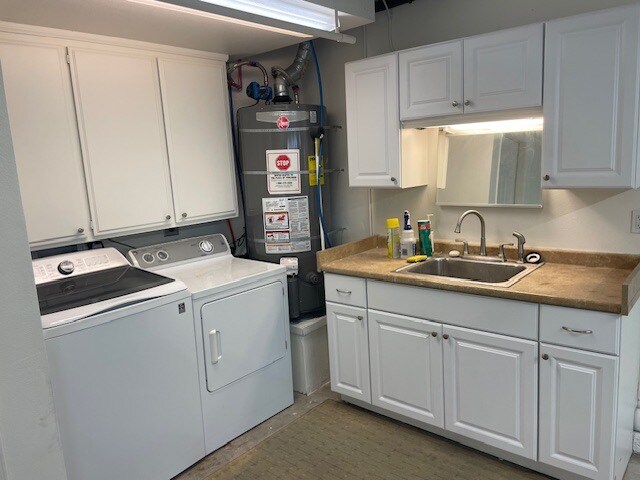 Washer, dryer, 50 gallon water heater with never-cold recirculation, sink with shelving - 10545 Kemerton Rd