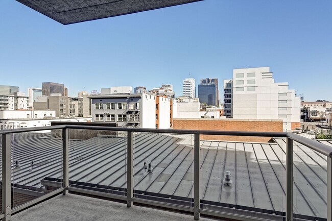 Building Photo - Modern Downtown Condo in Premier High-Rise...